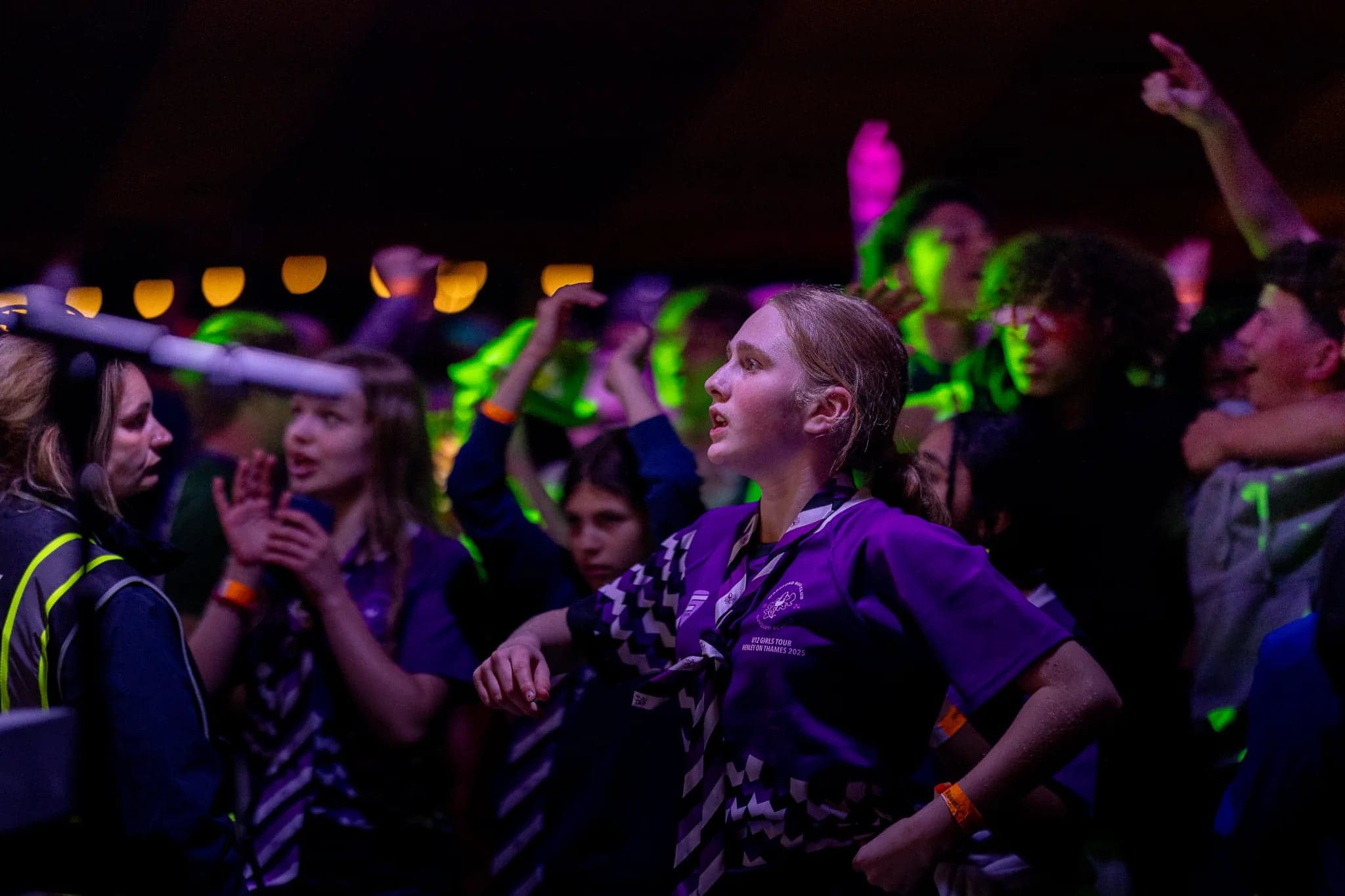 An Under 16 squad in club kit dancing together at the festival showbar