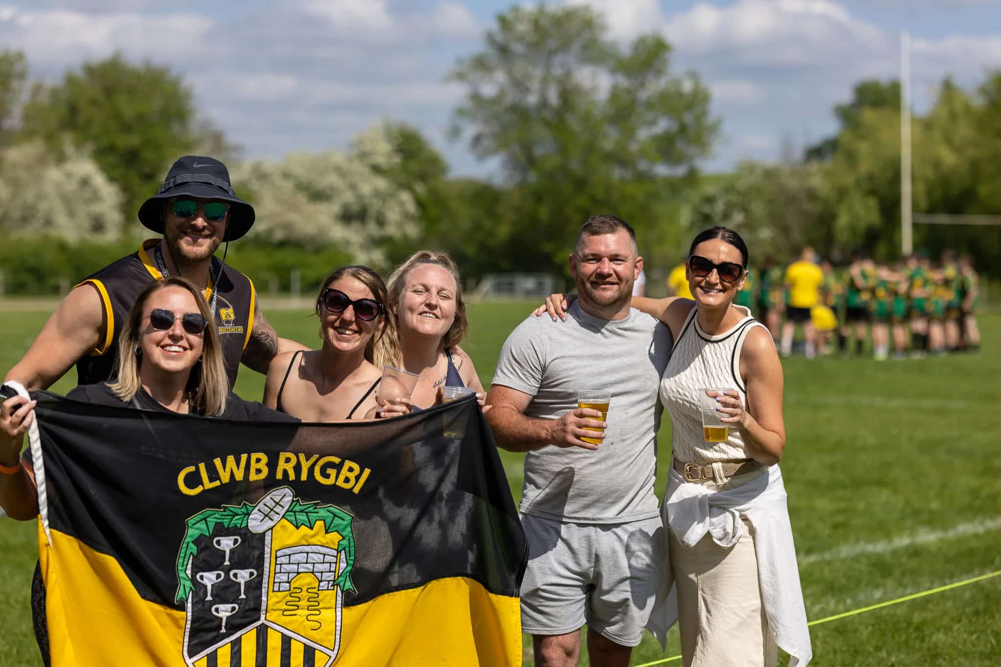 families with CLWB RYGBI flag on the pitch