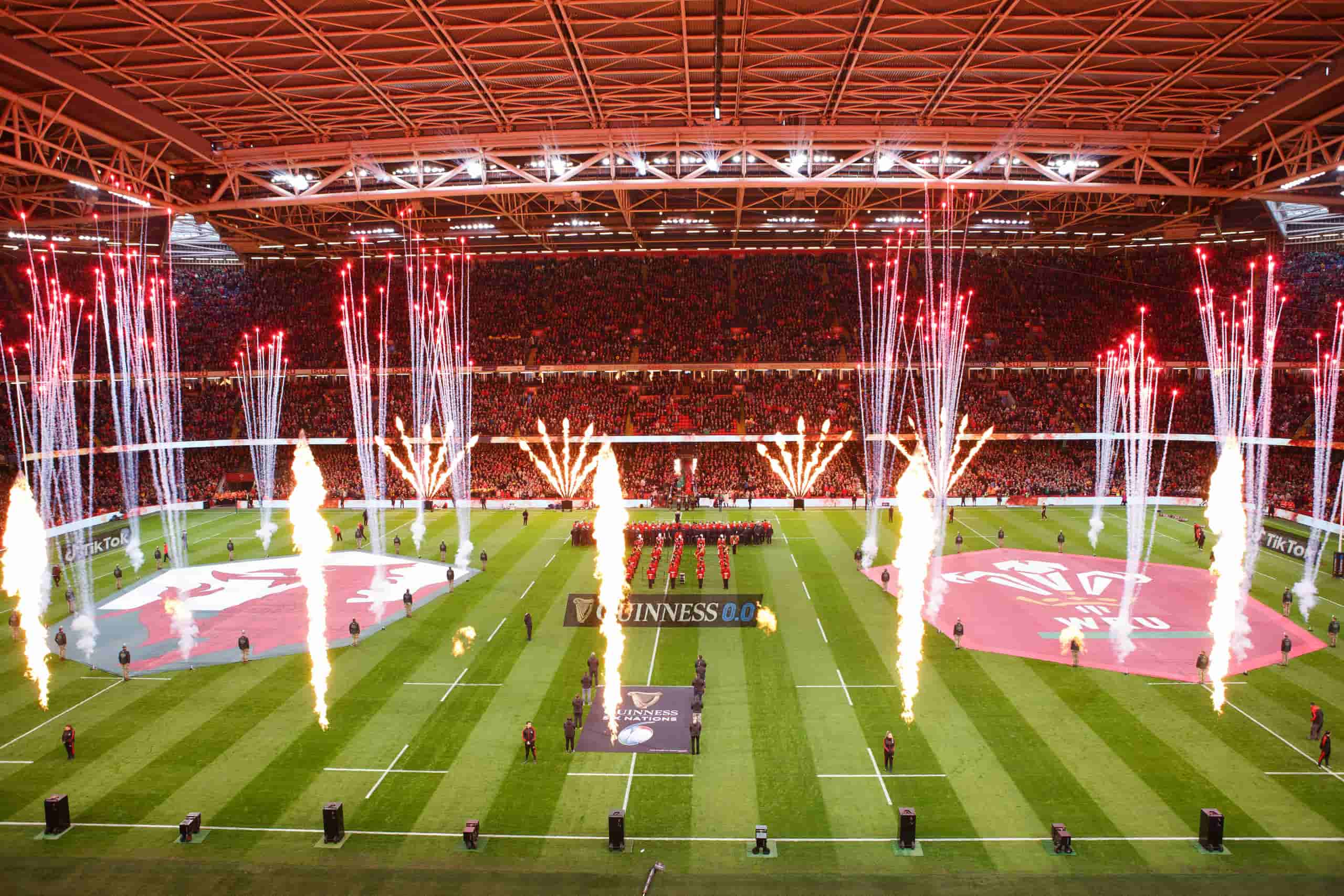 Fireworks and flames as the teams walk out at a packed international rugby stadium